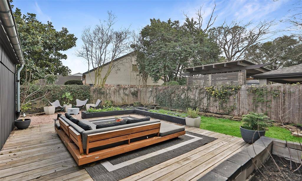 Second outdoor area with deck and firepit area! Surrounded by native plants soon to sprout to life!