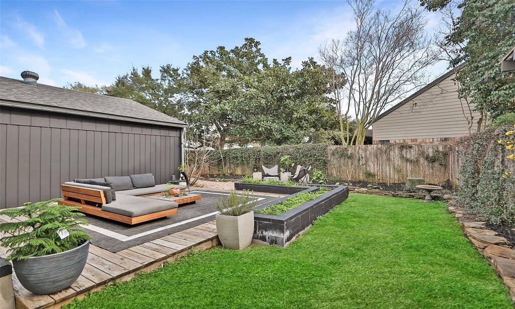 Fire pit is in the back of this photo, all native plants and fruit trees will soon be blooming!