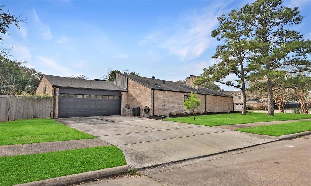 Huge lot includes a 2 car garage and a swing in the side yard. Window in this photo is above your kitchen sink!