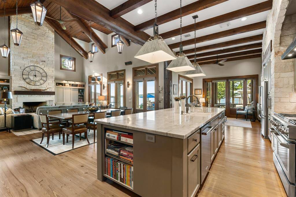 Note the room at the end. This is Flex space now being used as a cozy Den with the 2nd fireplace, offers endless possibilities .... a study, play room, another dining area ?