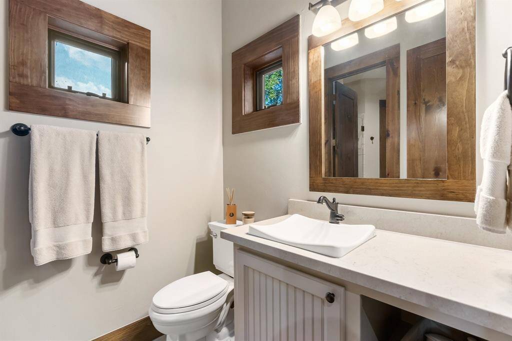 Each bedroom up has a private sink area with a shared glass enclosed oversized shower.