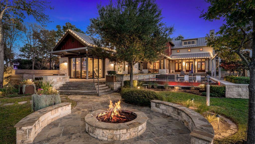 Take the chill off of a cool evening by this gorgeous open fire area.