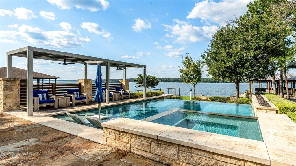 The "Cabana" seating ensures privacy from the left side. The Fire "Trough" runs along the right side of the pool   with a waterfall below it.