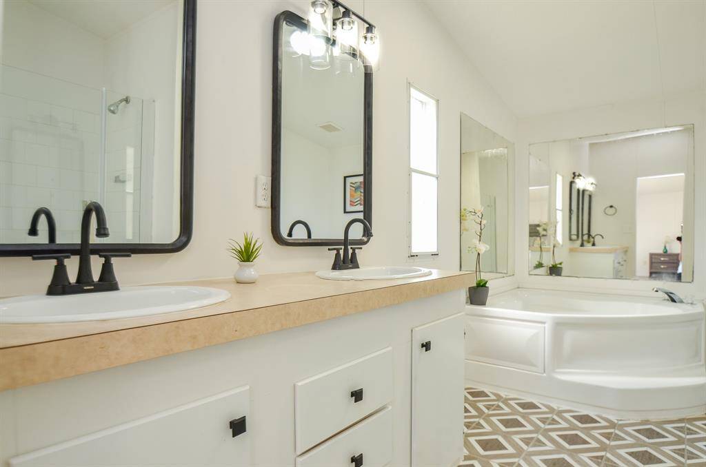Updated Primary bathroom with large garden tub and Updated shower.