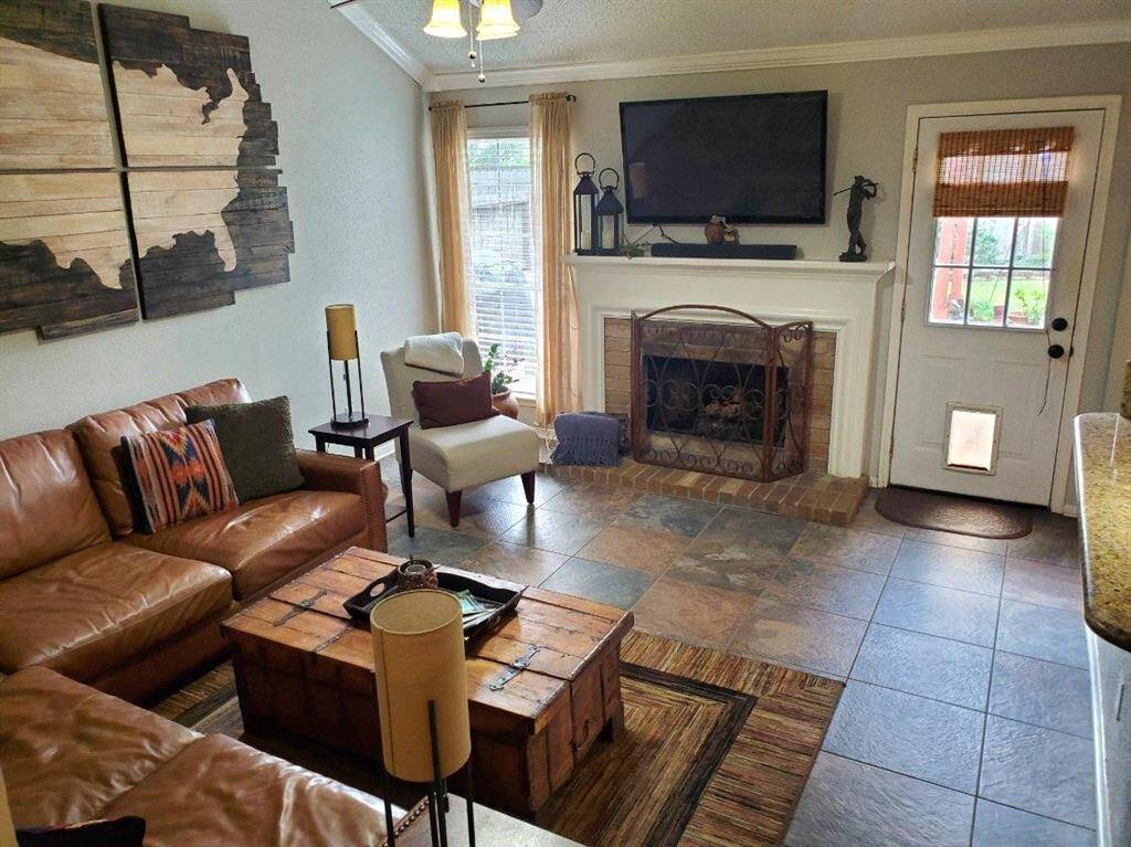 On the other side of the house is the den - tucked away from the front door, this area can also accommodate large furniture and be a retreat from prying eyes while providing access to the back yard. This is probably where you'll spend your time relaxing and watching TV.