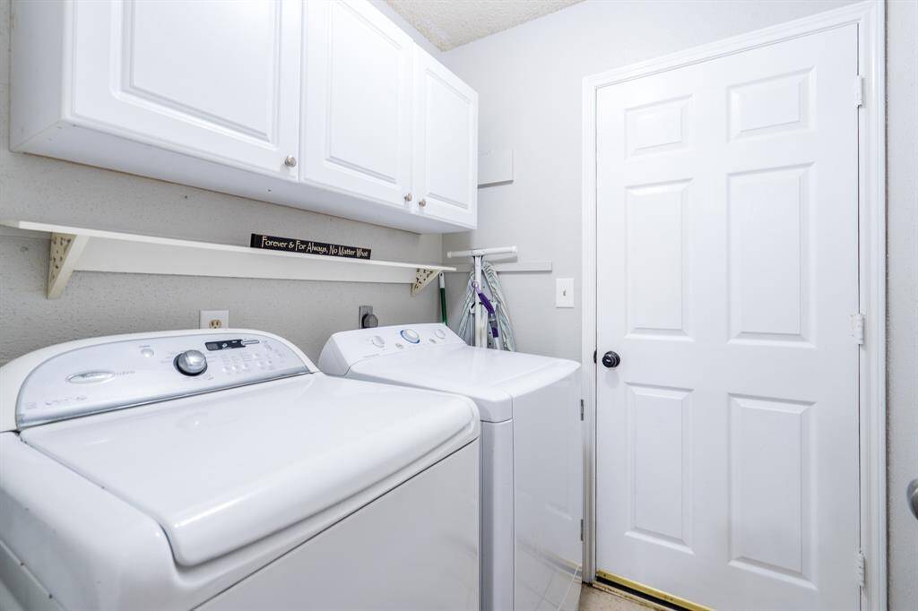 The utility room lies next to the garage, and is far away enough from the community areas so that you don't have to listen when laundry is the task for the day.