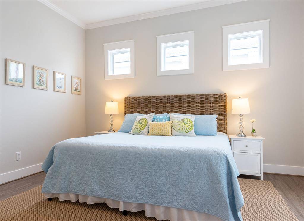 The primary bedroom is privately located on the first floor and has French Doors opening directly onto the waterfront deck.