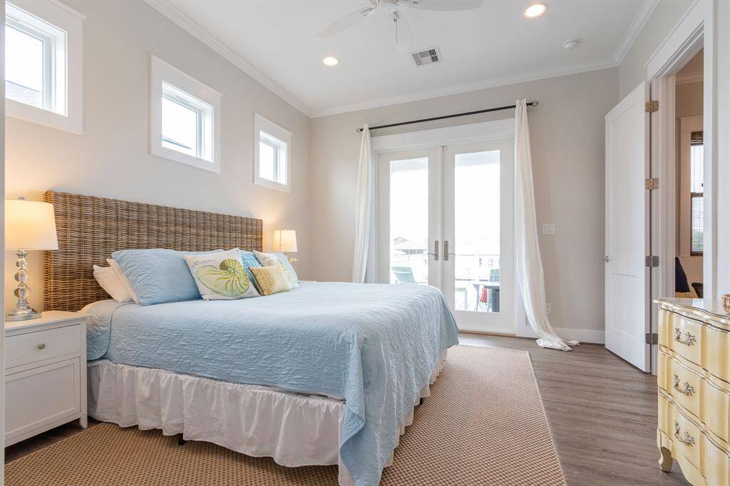 The primary bedroom is privately located on the first floor and has French Doors opening directly onto the waterfront deck.