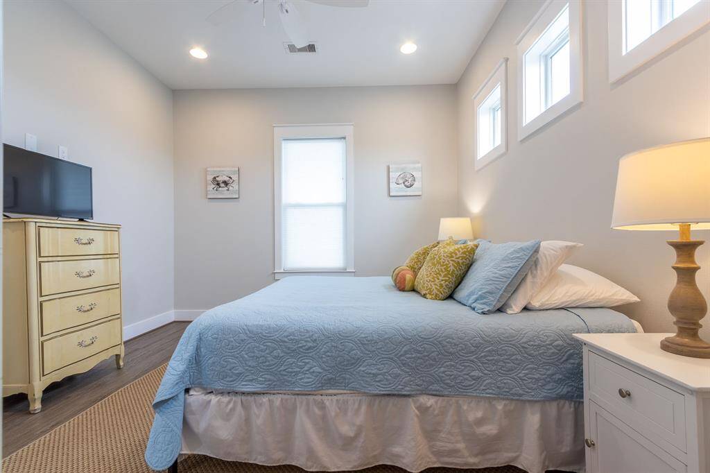 The primary bedroom is privately located on the first floor and has French Doors opening directly onto the waterfront deck.