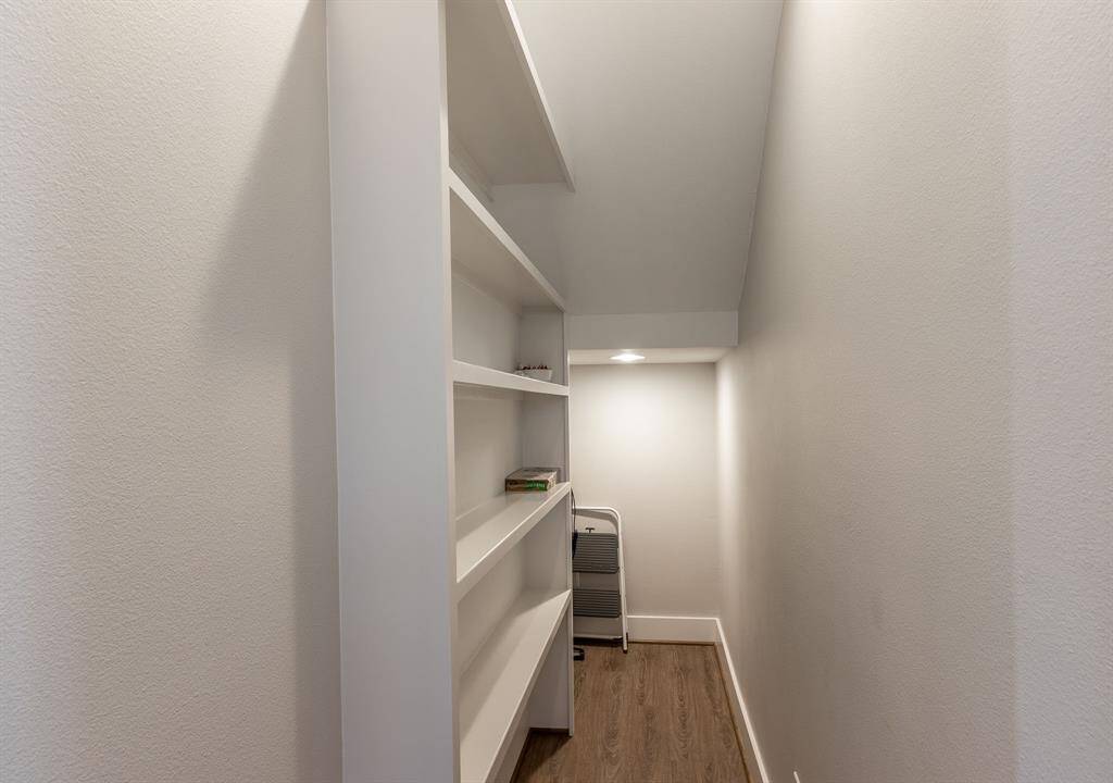 Maximize space with a convenient under-stairs storage closet.