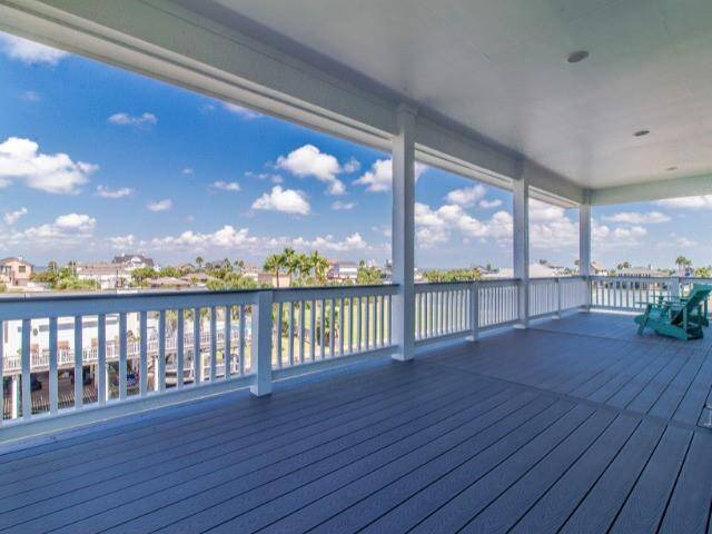 The spacious 3rd floor deck offers views of the bay & incredible sunsets.  Sits higher than most of the surrounding homes for magnificent views.  Located right off the French Doors in the Flex room.