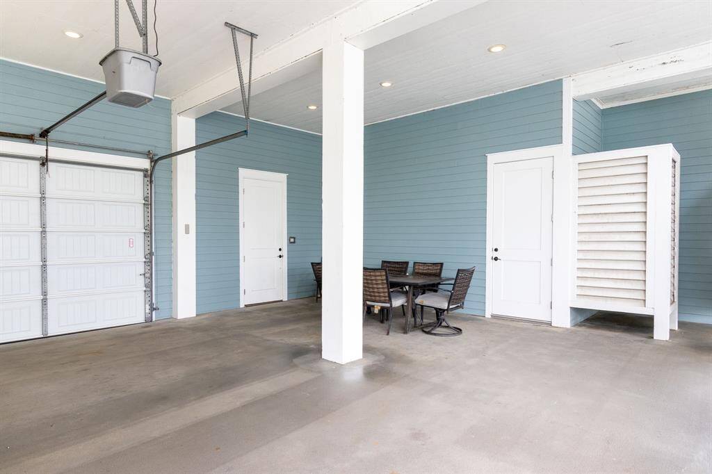 Outdoor main level area offering ample space for parking, outdoor activities and an outdoor shower to wash off those sandy toes!  Great space for entertaining.