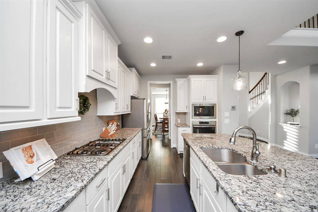 The chef of the kitchen will be thrilled with the gas stovetop and family room views