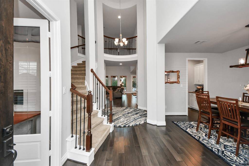 Breathtaking rotunda entrance with office space and formal dining