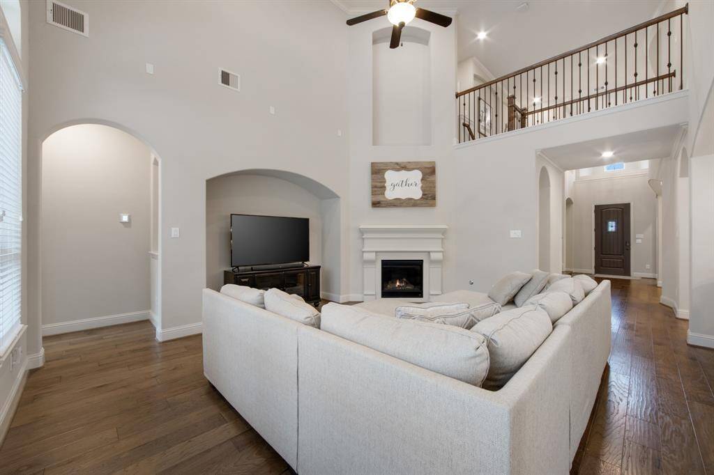 Huge family room with recessed wall for entertainment center, cast stone fireplace with direct vent