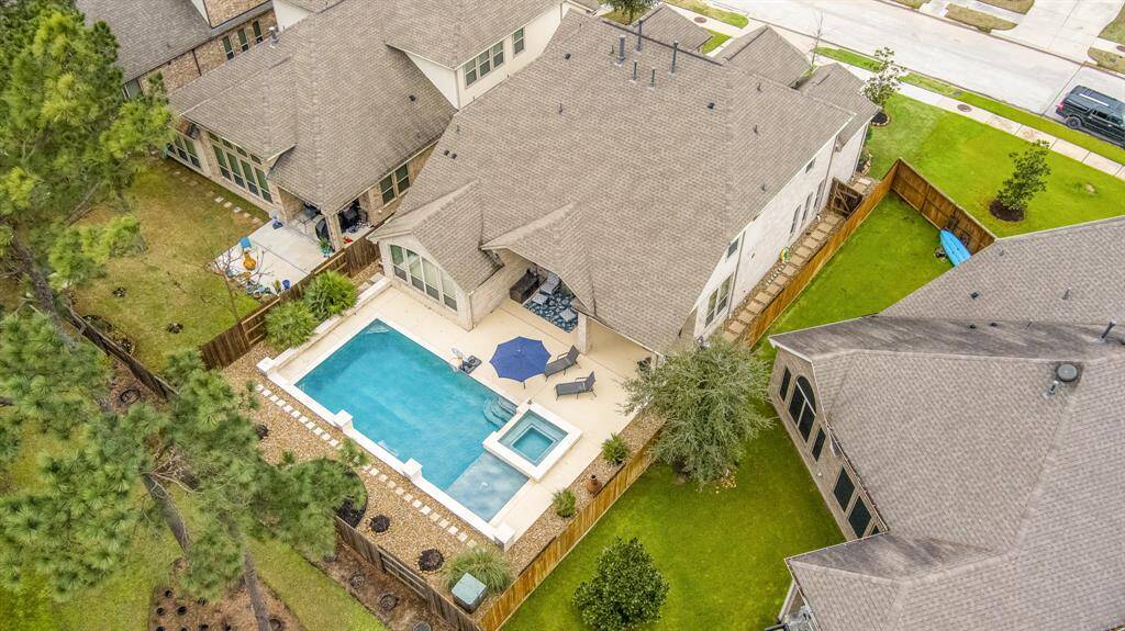 Pool, hot tub with water falls added in 2021. With cool decking, french drains and separate electrical panel.