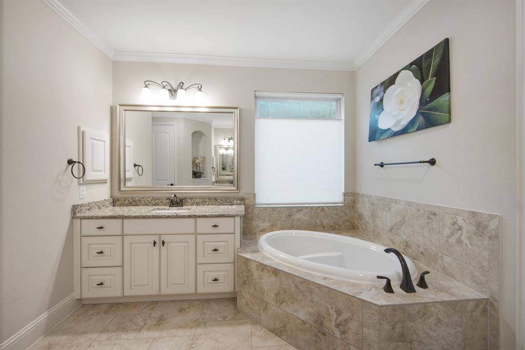 Dual sinks, dual medicine cabinets, relaxing oval garden tub and an abundance of storage space