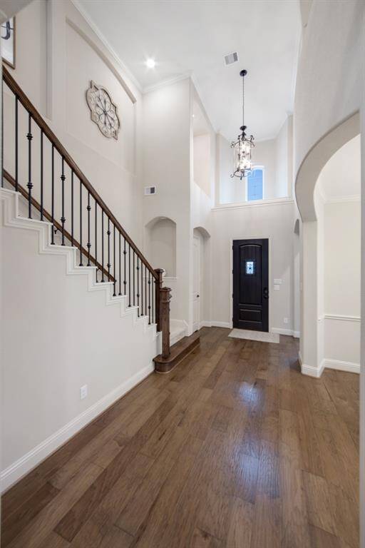 Beautiful grand Foyer with gorgeous wood flooring throughout all downstairs living areas