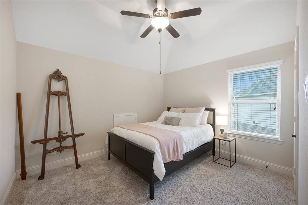 Third upstairs bedroom with 5 blade ceiling fan and walk-in closet