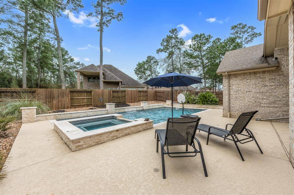 38'X17'X6' Gunite pool with travertine tile coping and glass tile inside at the water line. Cool decking and multiple French drains