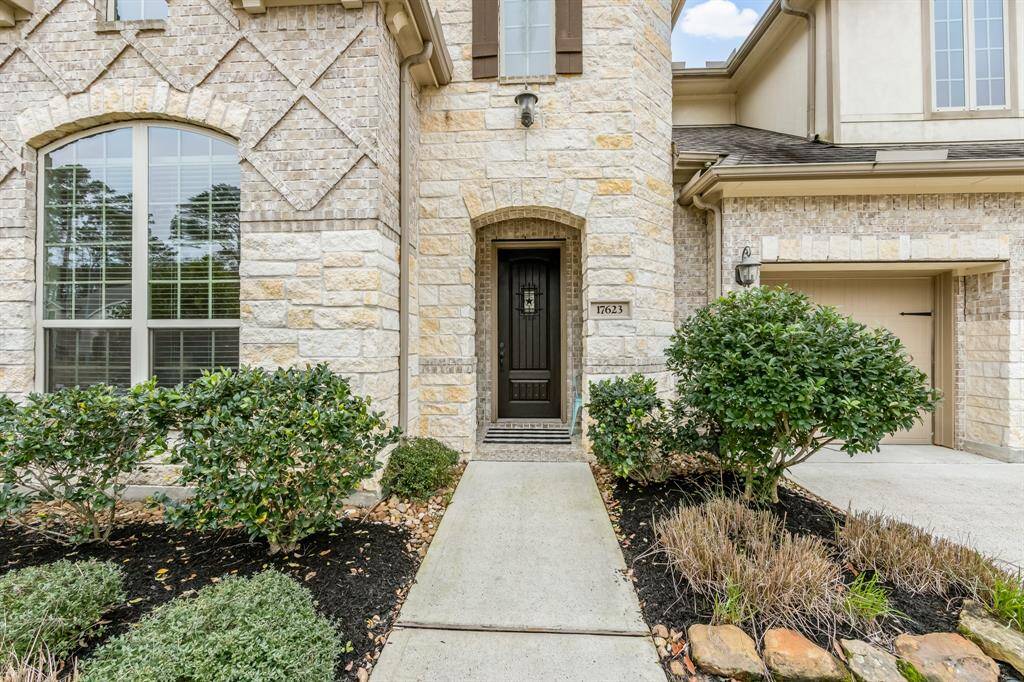 Front of home offers neutral brick and stone. Insulated front door with look-out window. Two HVAC systems, two 40 gallon H2O