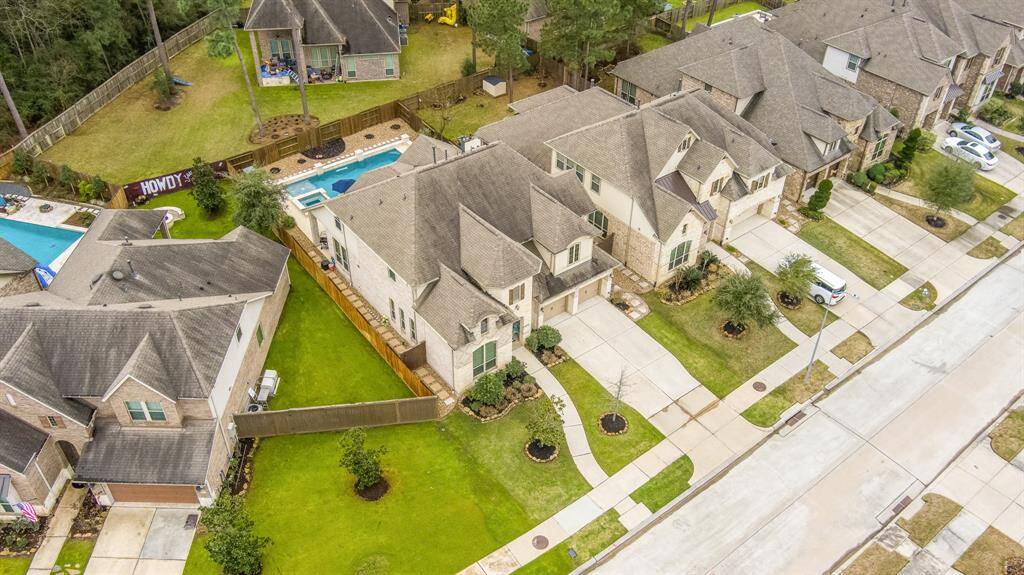 Exterior features long double wide driveway, concrete stepping stones and river rock down both sides on the home. Low maintenance landscaping and sprinkler system