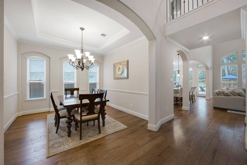 Spacious formal dining room with chair railing is next to the kitchen for easy access. This is an extremely beautiful and clean home.