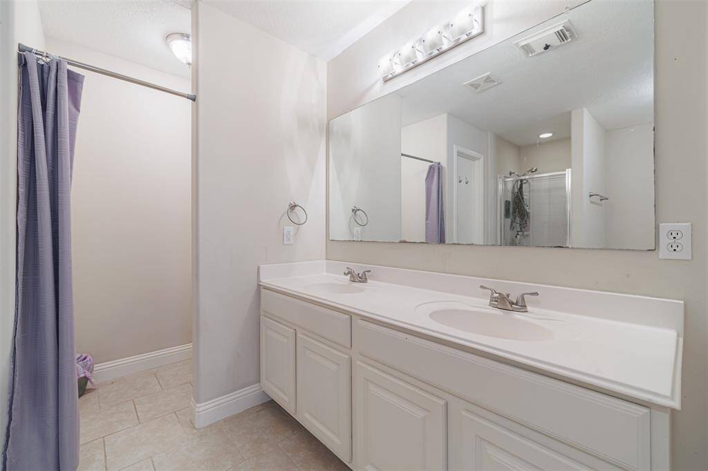Primary bath also features double sinks.