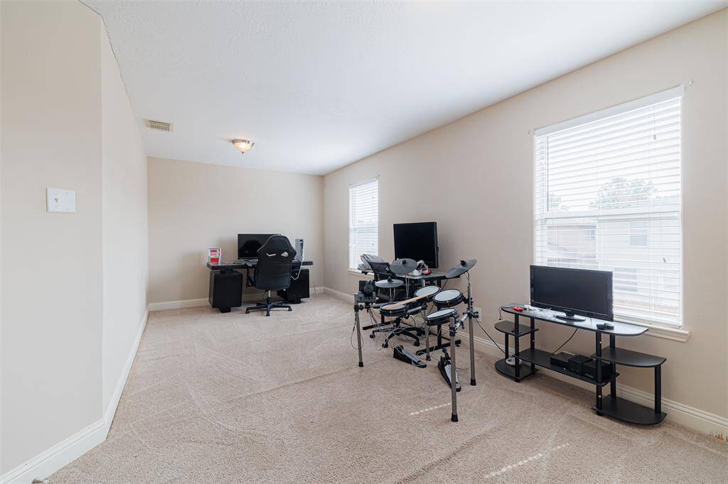 Large study with double doors located upstairs, could also be used a media room.