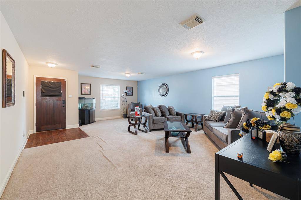 Entry leads to the formal living and dining areas.