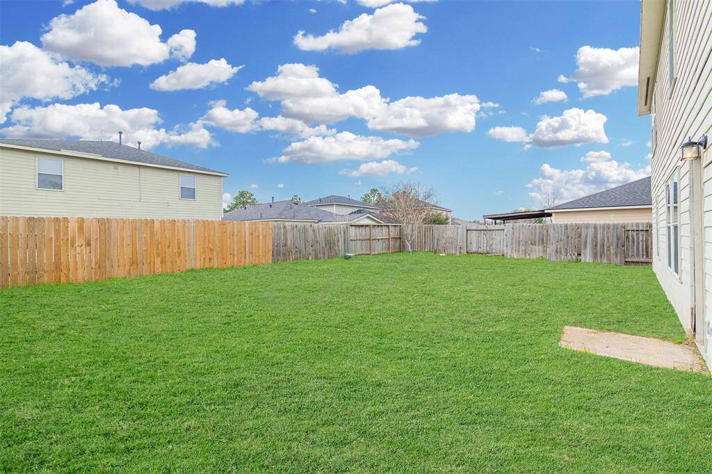 Large backyard great for outdoor get togethers.