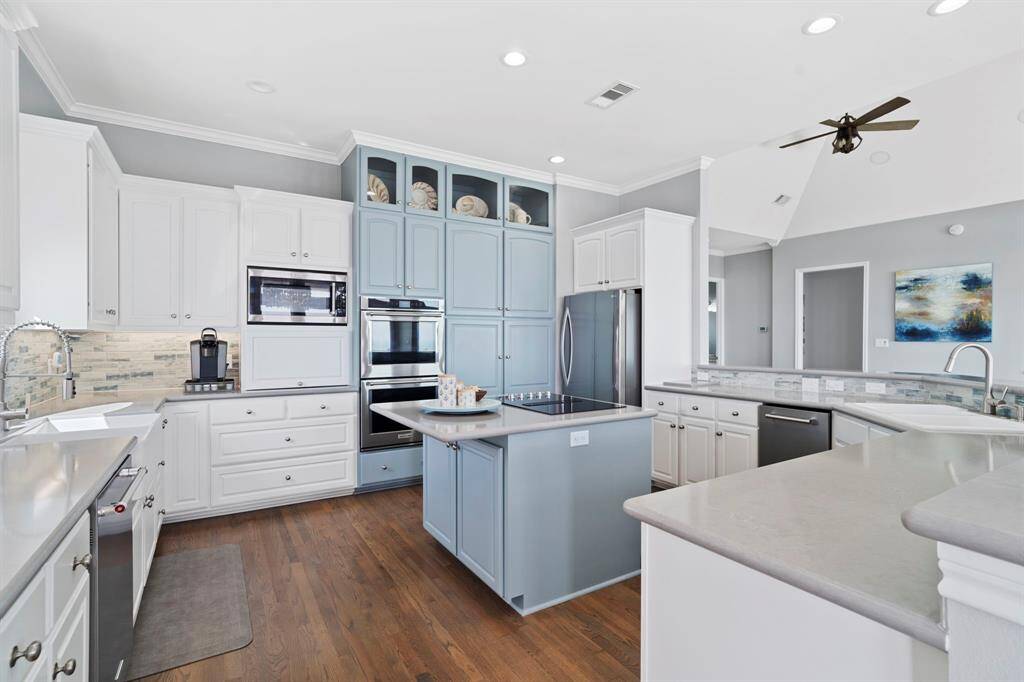The focal point is a sleek island thatnot only provides additional counterspace but also serves as the cooktop.