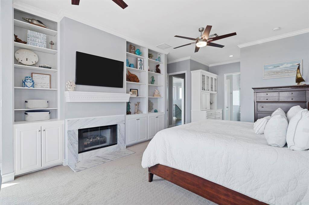 Soft carpetingunderfoot adds a touch of luxury, and the fireplacecreates a warm and invitingatmosphere that extends throughoutthe space.
