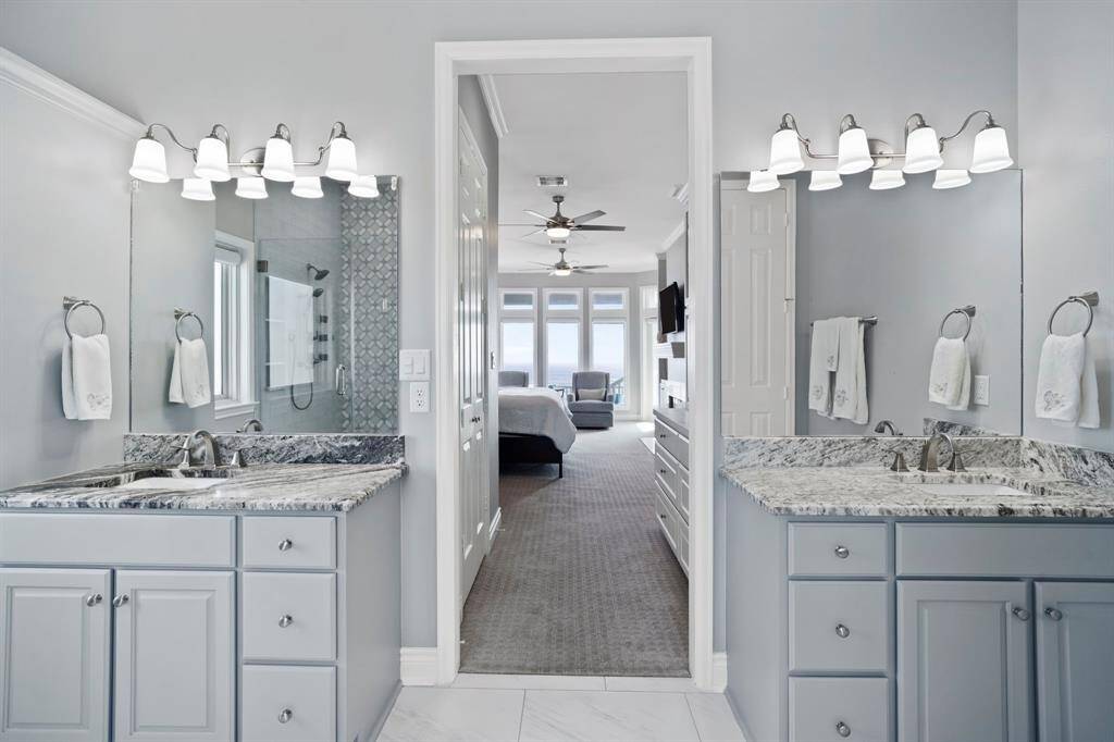 The primary bathroom features dual sinks.