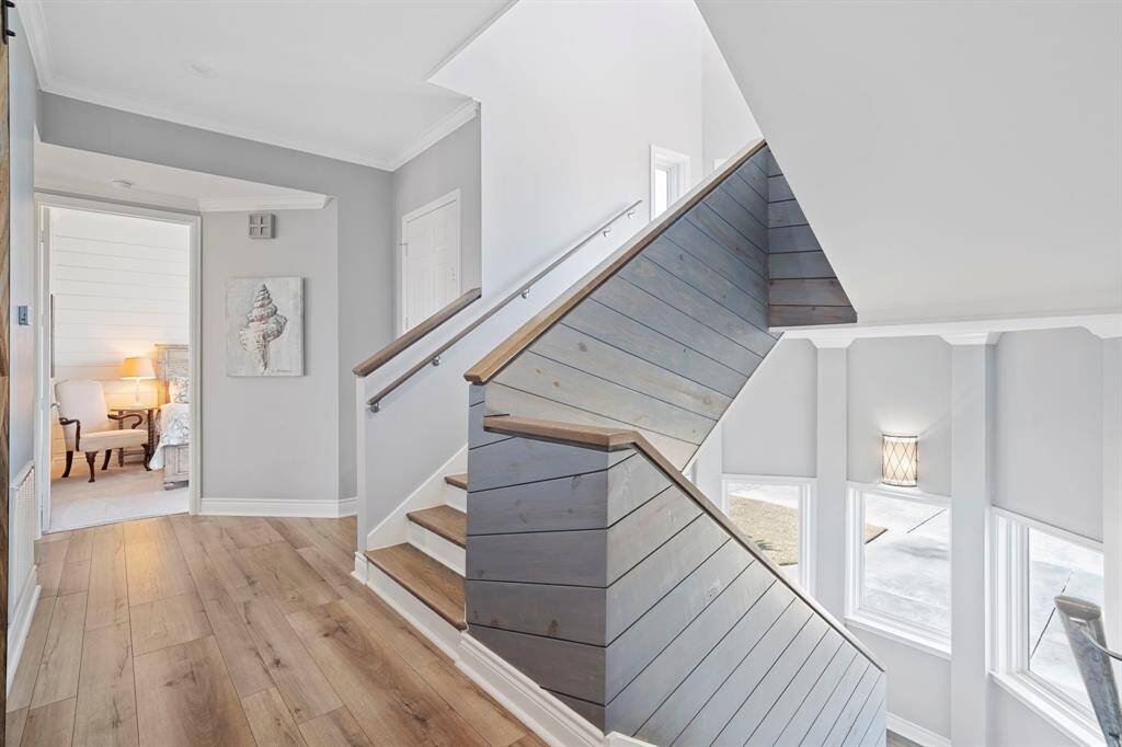 The staircase leads to the additional floors and bedrooms.