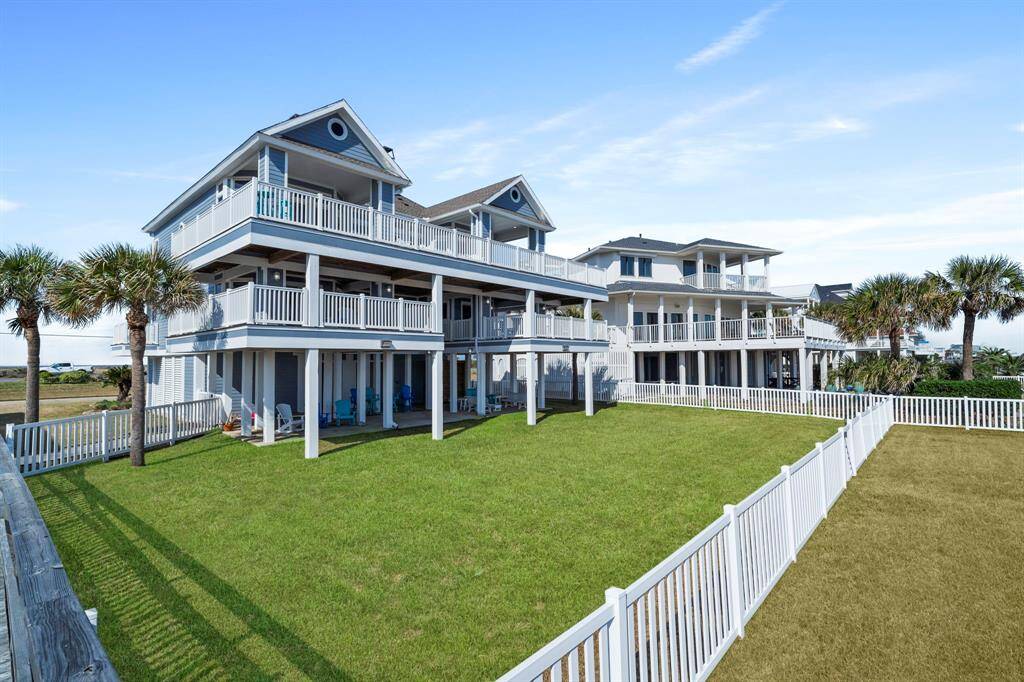 Step into the backyard oasis, with alarge covered patio and balconies, creating aninviting outdoor retreat overlooking the beach.