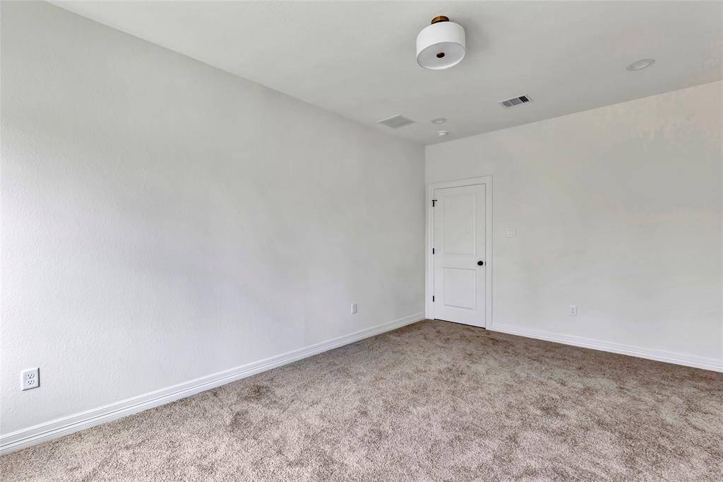 Spacious bedroom 2 with private en-suite bath.