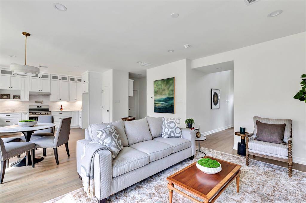 Spacious open-concept living room, seamlessly connecting to the kitchen for effortless entertaining.