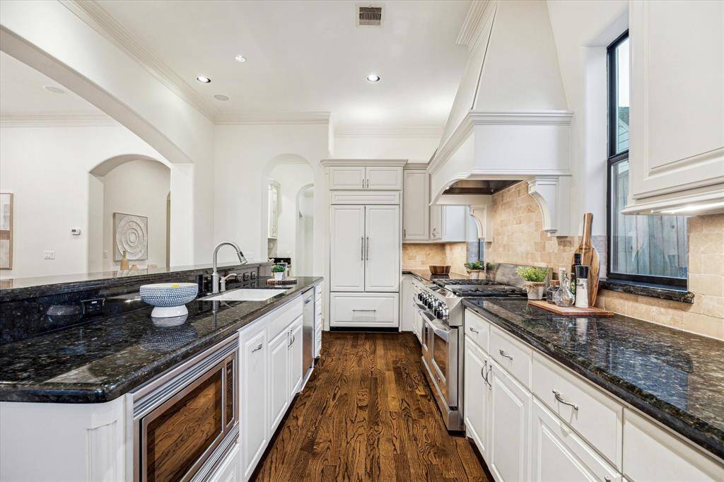 The kitchen offers an abundance of storage and has ample counter space to prep your favorite meals.