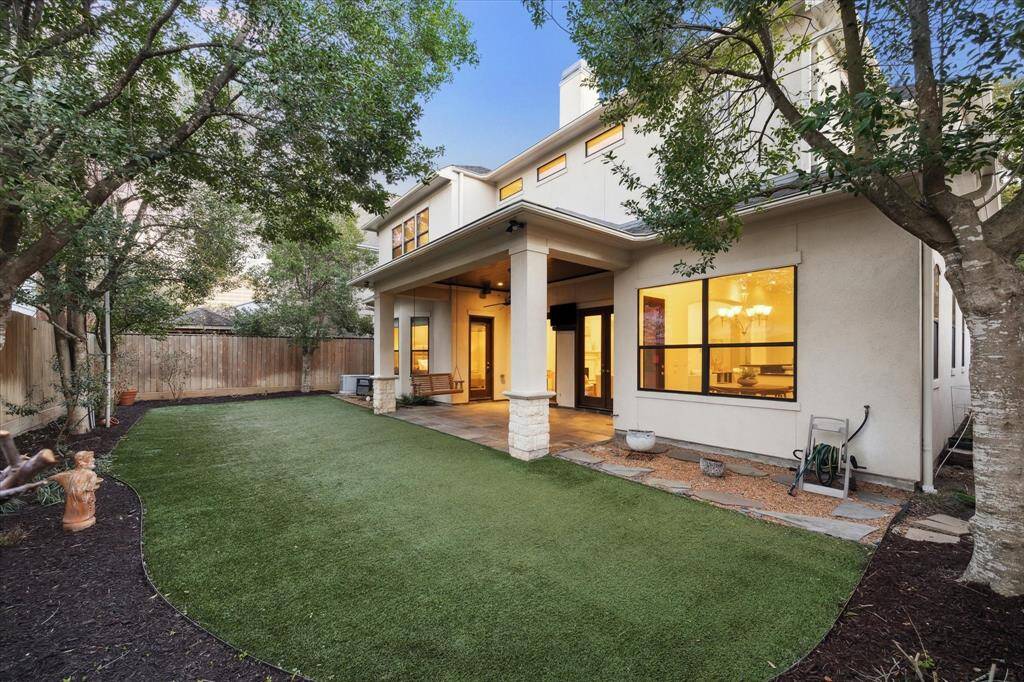The backyard is nicely appointed with a large, covered patio overlooking a turfed and landscaped yard.