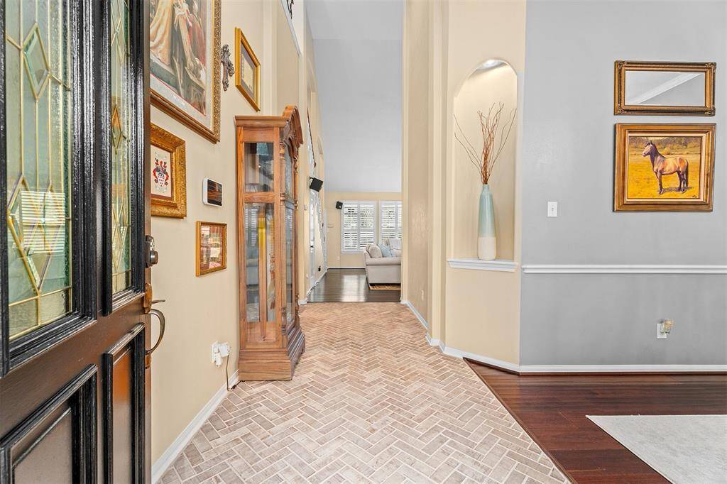 Welcome to this inviting open-concept home, featuring a modern kitchen and cozy living area, perfect for entertaining and relaxation.