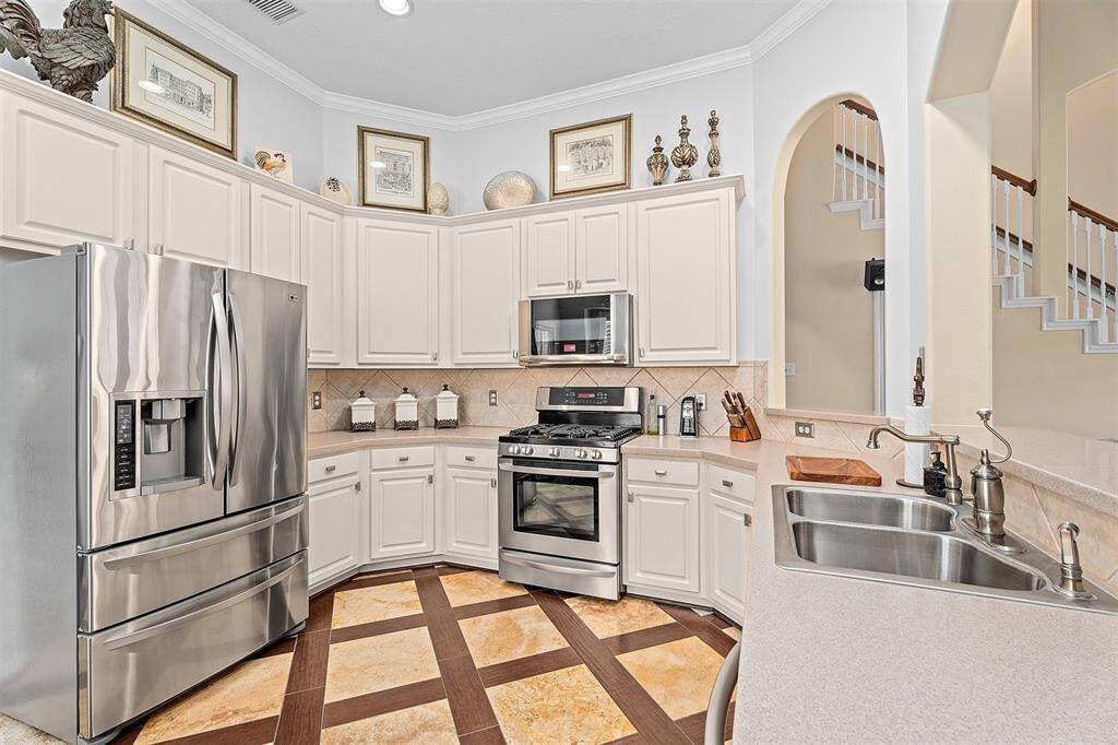 Ample storage and counter space surround the gas range.