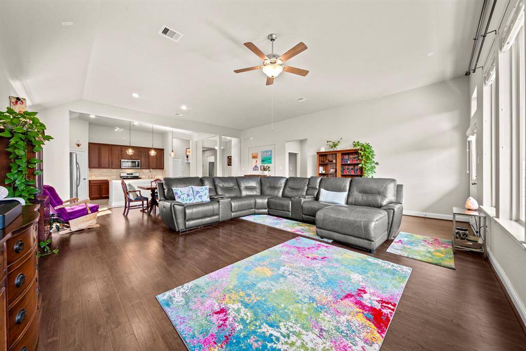 Ample space in this large living area for oversized furniture arrangements.  Large windows provide abundant natural light!