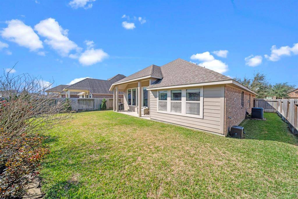 An extended covered patio accents this home's private backyard setting.