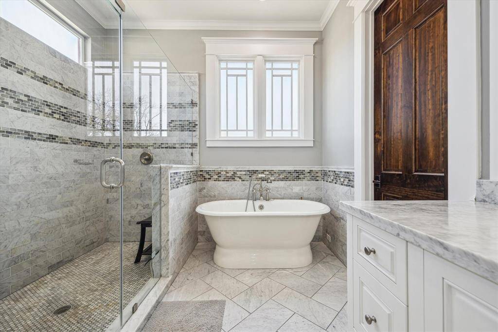 Beautiful tile work. Freestanding tub and separate shower.