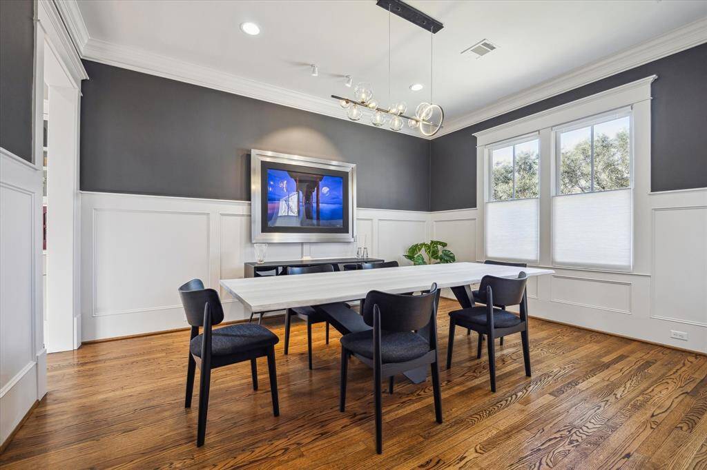 Dining room with elegant waintscotting.