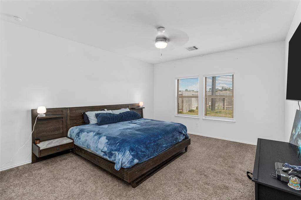 HUGE primary bedroom overlooking the backyard.