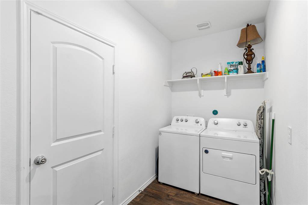 Lots of work space in the laundry room, conveniently located with access to the garage.