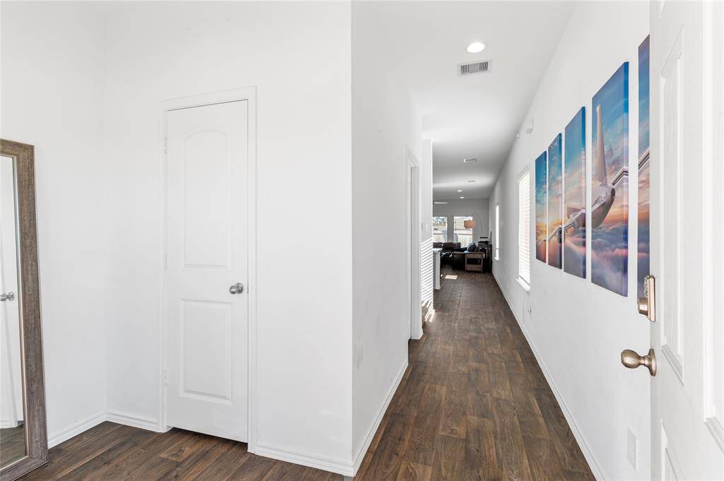 Entry hall with access to half bath for guests.
