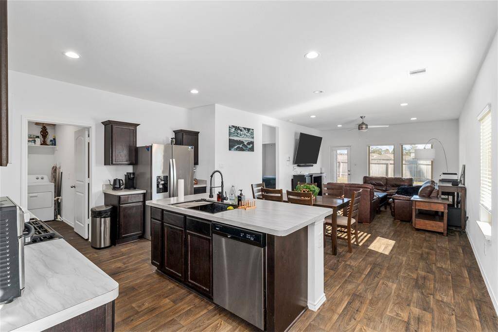 Here is your view of the kitchen, dining, and living area. This is the hub of the home.